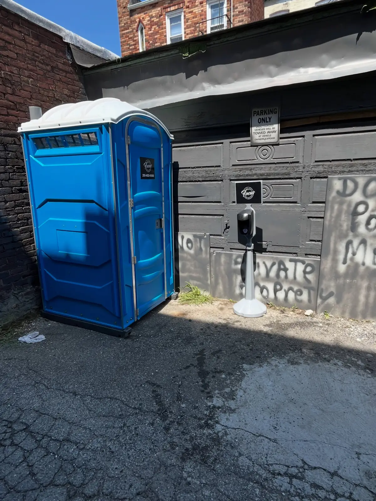 Porta potty placed beside a business