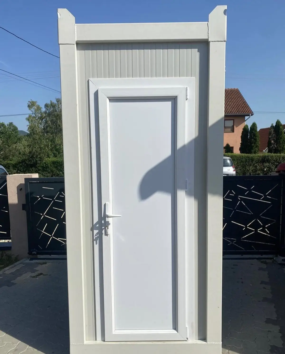 White single-stall luxury restroom cabin
